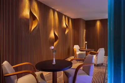 a restaurant with two tables and white chairs at Hotel Sansi Barcelona in Barcelona