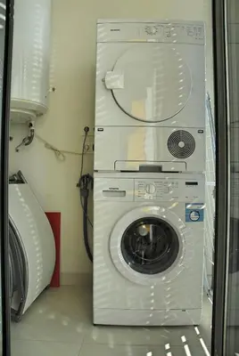a washer and dryer sitting in a room at Apartaments Can Negret in Sitges