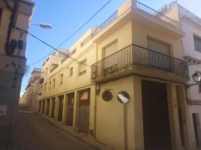 a row of buildings on the side of a street at Apartamento duplex vacacional in Arenys de Mar