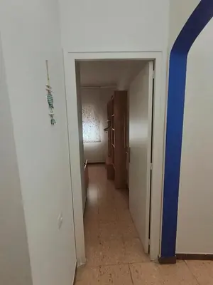 a hallway with a hallway leading to a room with at Apartamento duplex vacacional in Arenys de Mar