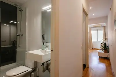 a bathroom with a sink and a shower and a toilet at Cute Apartment in Barcelona