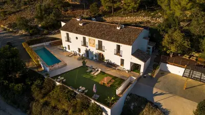 an aerial view of a house with a swimming pool at Villa Masia Capdet in Sant Pere de Ribes