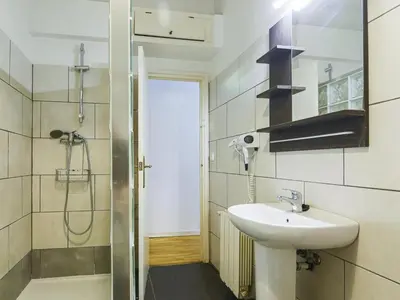 a bathroom with a sink and a shower at Be barcelona arco del triunfo sunny colors III in Barcelona