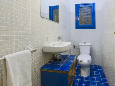 a bathroom with a white toilet and a sink at Be barcelona arco del triunfo sunny colors III in Barcelona