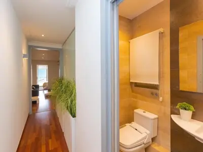 a bathroom with a toilet and a sink at Apartment Centro- Passeig de Gracia - Casa Batllo by Interhome in Barcelona