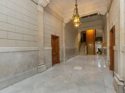 an empty hallway of a building with a chandelier at Apartment Centro- Passeig de Gracia - Casa Batllo by Interhome in Barcelona