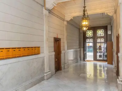 a hallway of a building with a chandelier at Apartment Centro- Passeig de Gracia - Casa Batllo by Interhome in Barcelona