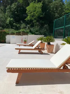 a row of benches sitting on a patio at Hotel Robert in La Pobla de Claramunt