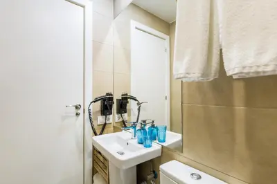 a bathroom with a sink and a mirror at El Born Guest House by Casa Consell in Barcelona