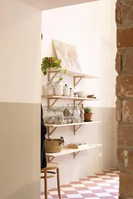 a room with shelves with plants and a chair at CASA FILOMENA in Barcelona