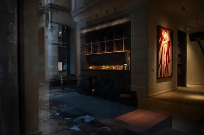 a room with a fireplace with a picture on the wall at Hotel California in Barcelona