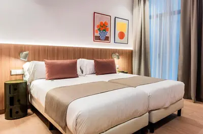 a bedroom with a large bed in a room at Hotel California in Barcelona