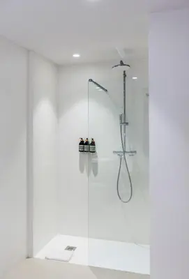 a shower with a glass door in a bathroom at Hotel California in Barcelona