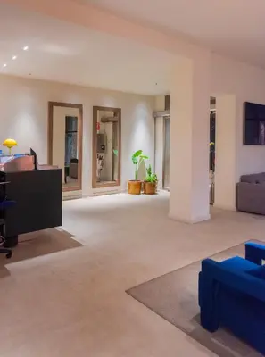 a living room with a couch and a tv at Hotel California in Barcelona