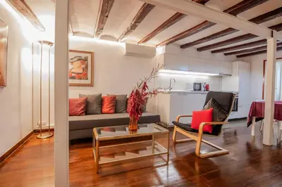 a living room with a couch and a table at Pedrera - Gràcia in Barcelona