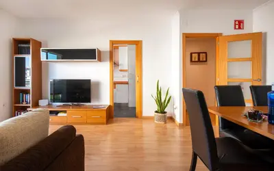 a bedroom with a bed with towels on it at BONITO APARTAMENTO in Sitges