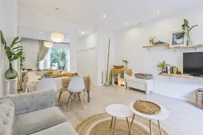 a living room with a couch and a table at Apartment Gaudi in Sitges