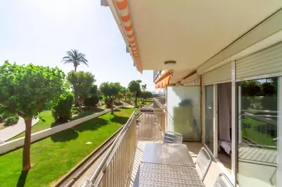 a balcony with chairs and a view of a street at Residencial Costamar next Bcn, 50m beach with swimming pool in Cabrera de Mar