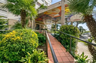 a building with a mural on the side of it at Can Mabi, 30' Bcn next beach in Vilassar de Mar