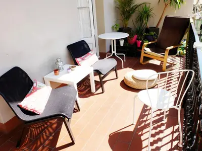 a living room with chairs and a table and a table at Fabrizzio's Petit in Barcelona