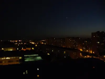 a view of a city at night with lights at Atico Soleado Vistas panoramicas in Hospitalet de Llobregat