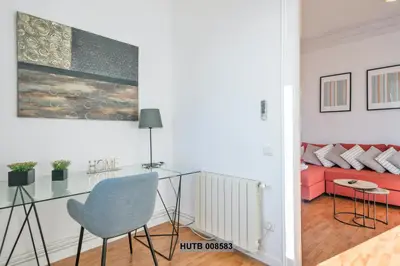 a living room with a glass table and a couch at Alcam Berlin-Numancia in Barcelona