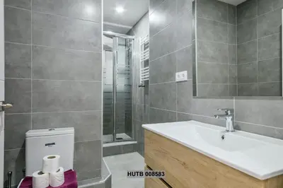 a bathroom with a sink and a shower and a toilet at Alcam Berlin-Numancia in Barcelona