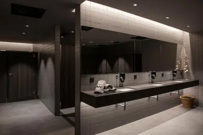 a bathroom with three sinks and a large mirror at Les Cabanes de l'Oller del Mas in Manresa