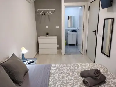 a bedroom with a bed with two pillows on it at Hostal Urban Basic in Hospitalet de Llobregat