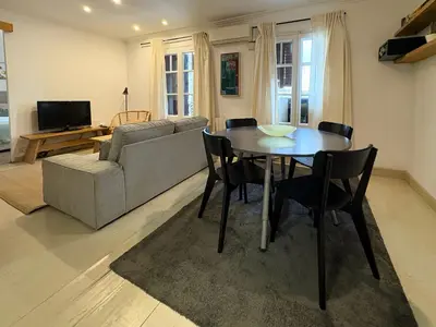 a living room with a table and a couch at Stay U-nique Apartments Borbó in Barcelona