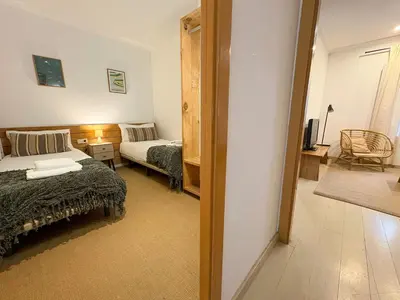 a small bedroom with a bed and a couch at Stay U-nique Apartments Borbó in Barcelona