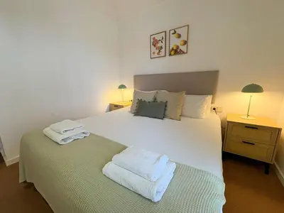 a bedroom with a large white bed with towels on it at Stay U-nique Apartments Borbó in Barcelona