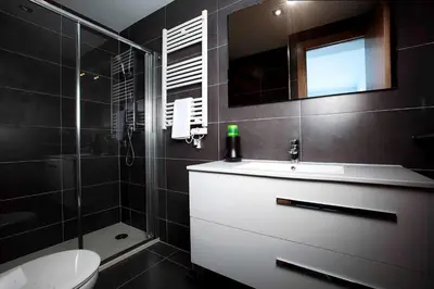 a bathroom with a sink and a toilet and a shower at Apartamentos Sunway Talaia in Sitges