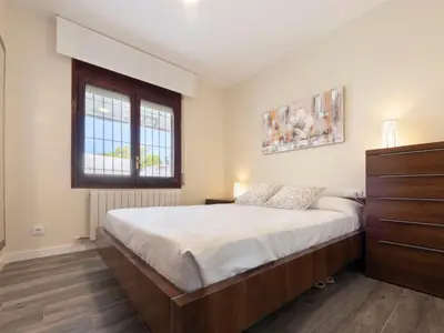 a bedroom with a large bed and a window at Holiday Home Aeris by Interhome in Cunit