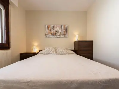 a bedroom with a large bed and two dressers at Holiday Home Aeris by Interhome in Cunit