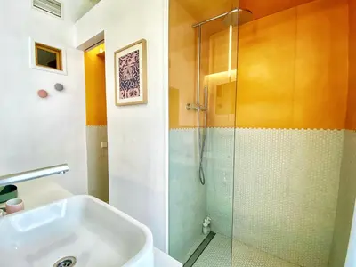 a bathroom with a shower and a sink at Tyche apartment in Barcelona