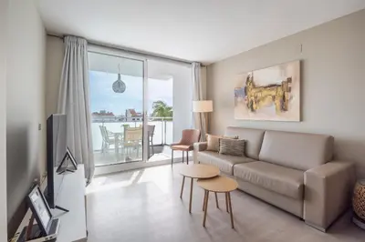 a living room with a couch and a table at Sitges Spaces Oasis Penthouse 3 Bedroom, 2 Bathroom, Terrace, Pool, Sleeps up to 6 in Sitges