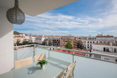 a balcony with a view of a city at Sitges Spaces Oasis Penthouse 3 Bedroom, 2 Bathroom, Terrace, Pool, Sleeps up to 6 in Sitges