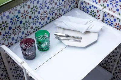 a table with two plates and napkins on it at Flat Barcelona in Barcelona