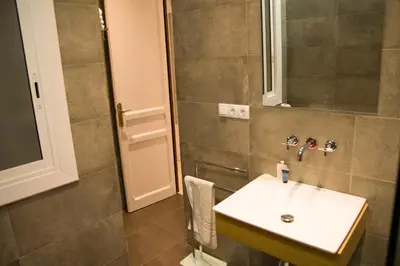 a bathroom with a sink and a mirror at Flat Barcelona in Barcelona