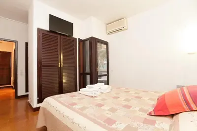 a bedroom with a bed with towels on it at Flat Barcelona in Barcelona
