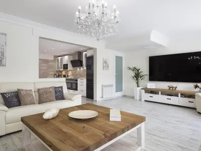 a living room with a couch and a coffee table at Sitges Spaces Mediterranean Apartments 4 Bedroom in Sitges