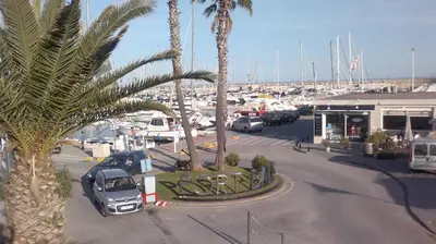a parking lot with cars parked in a marina at Apartment Llavaneres I in Sant Andreu de Llavaneres