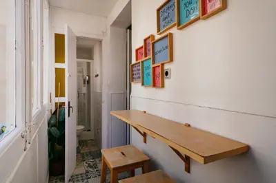 a room with a wooden bench on the wall at Nice Apartment in Barcelona