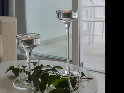 two wine glasses sitting on a table with a plant at Sitges Spaces Sea View Paradise- 2 Bedrooms, 2 Bathrooms, Terrace, Amazing Sea Views in Sitges