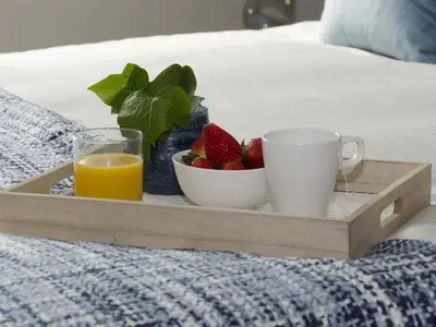 a tray with a plate of strawberries and a cup of orange juice at Sitges Spaces Sea View Paradise- 2 Bedrooms, 2 Bathrooms, Terrace, Amazing Sea Views in Sitges