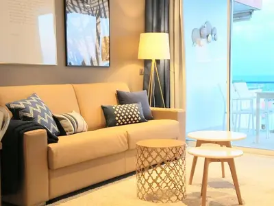 a living room with a couch and a table at Sitges Spaces Sea View Paradise- 2 Bedrooms, 2 Bathrooms, Terrace, Amazing Sea Views in Sitges