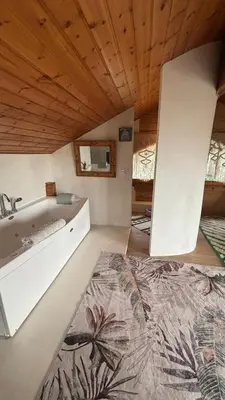 a bathroom with a sink and a tub at Les Suites in Santa María de Palautordera