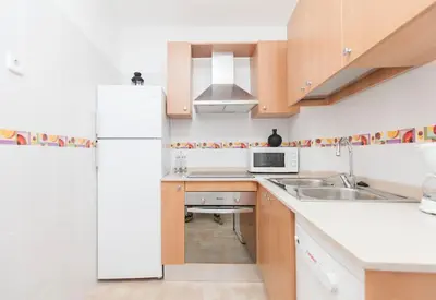 a bedroom with two beds with colorful sheets at Stay Barcelona Plaza España Fira in Barcelona
