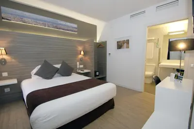 a hotel room with a bed and a bathroom at Hotel BESTPRICE Diagonal in Barcelona
